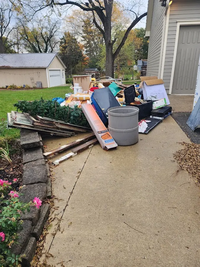 Dumpster being loaded with debris for 3 Yard Dumpster Rental in Fairview